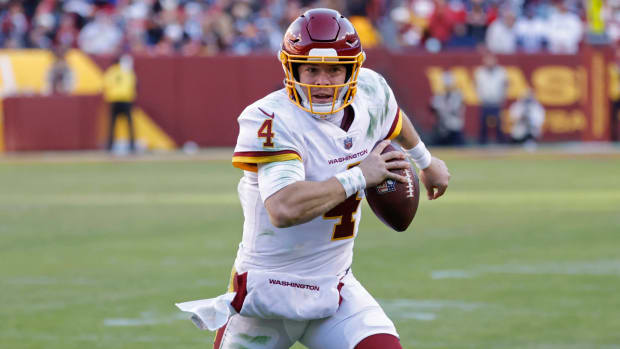 WFT quarterback Taylor Heinicke on the run against the Cowboys